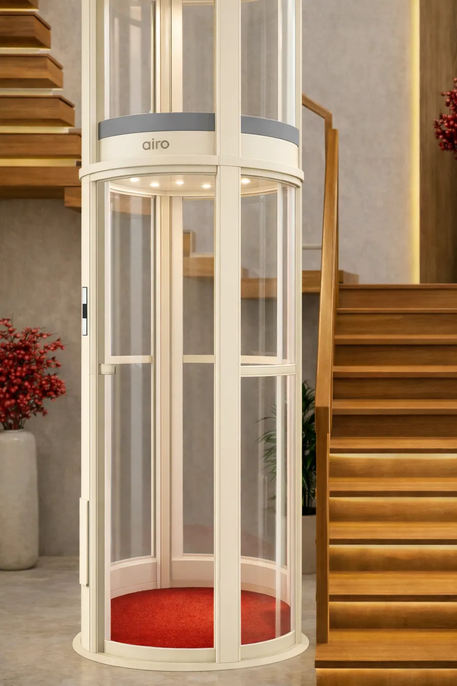 Airo pneumatic vacuum lift cabin installed beside a wooden staircase
