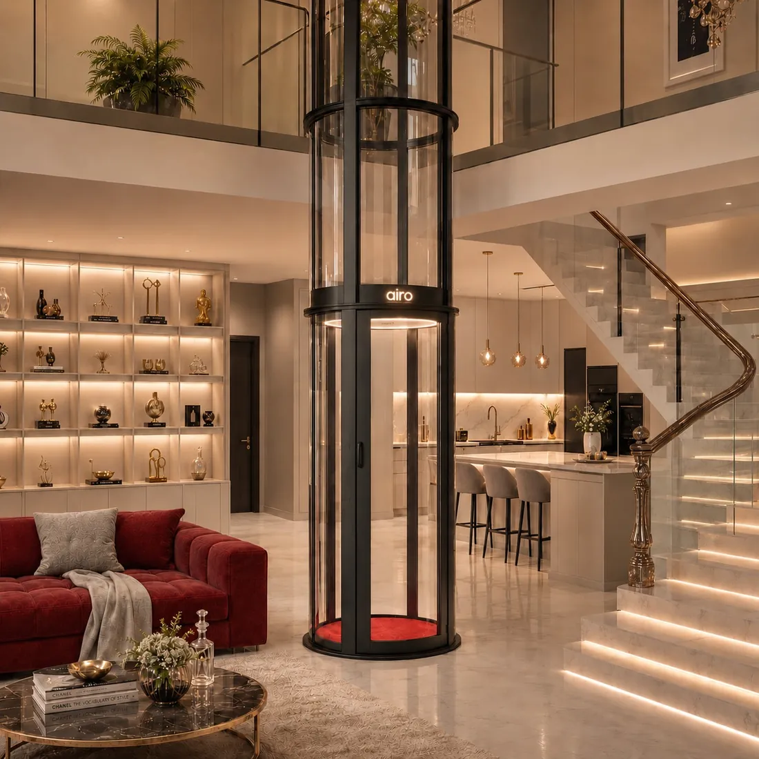 Airo panoramic vacuum elevator beside a marble staircase in a luxury Indian home